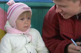 Mark interviews a Russian girl as part of his research.