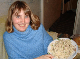 Genna with a plate of Beshbarmak, a traditional Kyrgyz dish 