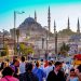 Crowds on the Galata Bridge with the Suleiman Mosque in the background.